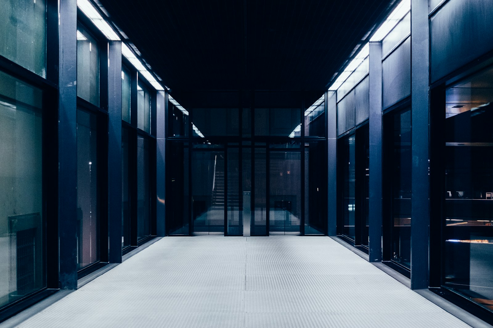 A corridor between rows of servers in a data center