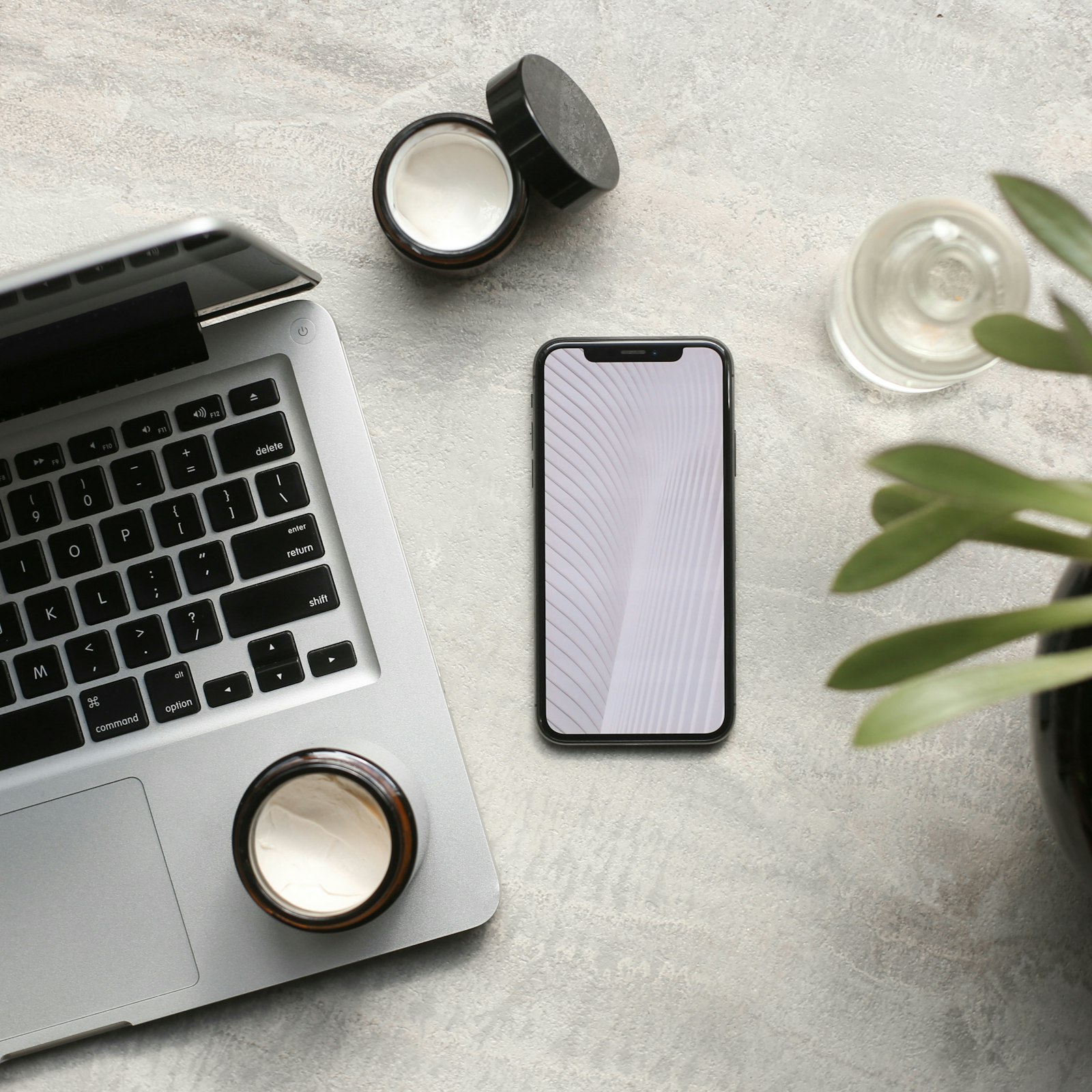 A hand holding a phone showing an app
