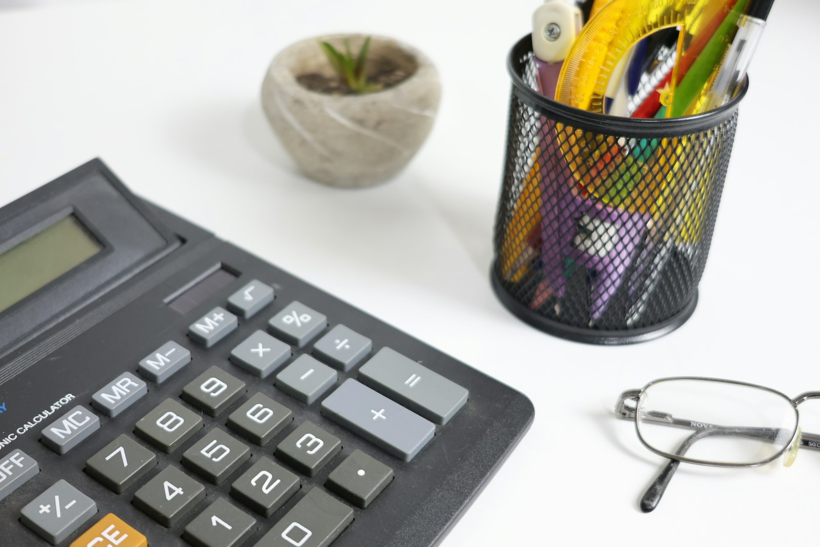 A finance workspace with a desk, documents and a laptop